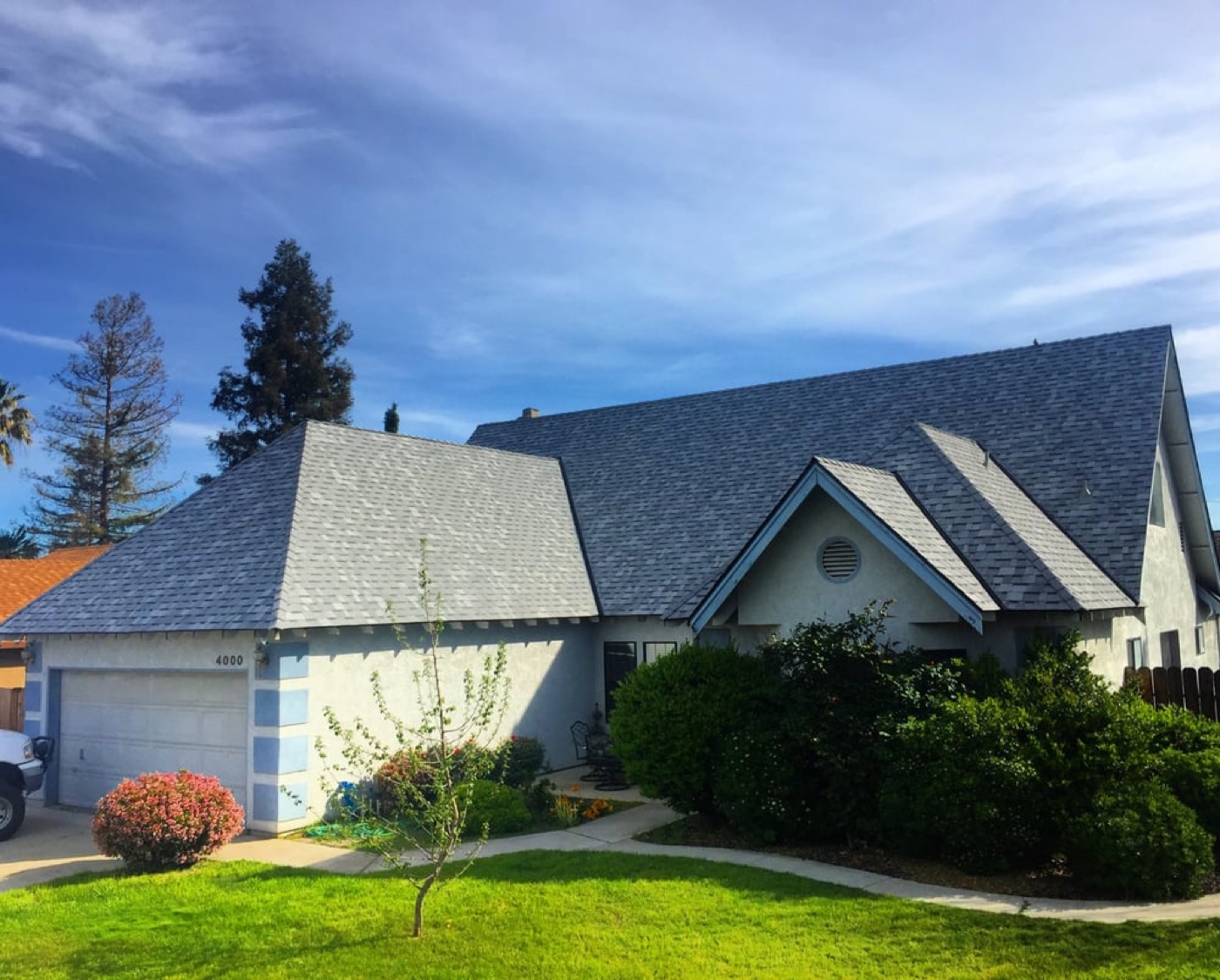 Central Valley home with light gray cool-rated architectural shingles meeting California Title 24 energy requirements