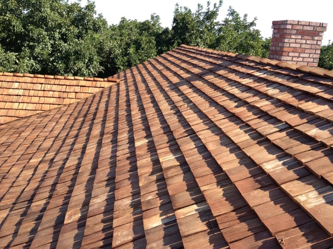 Aging wood shake roof in the Central Valley — example of why manufacturer-backed warranties matter