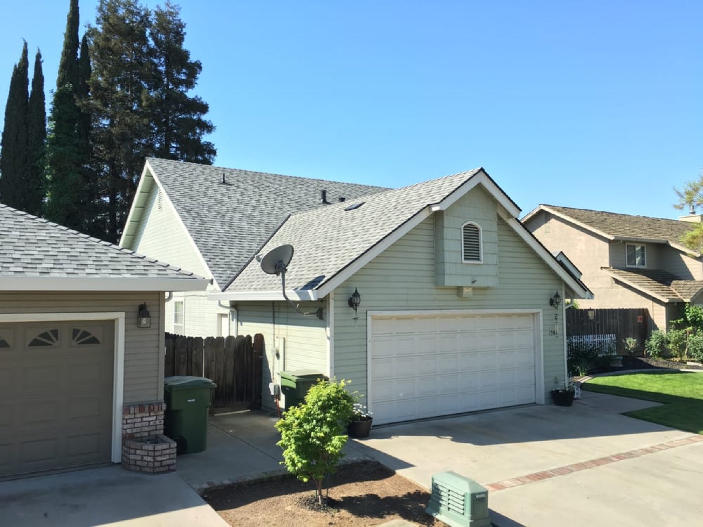 Multi-gable two-story home in Salida with architectural shingles — installed by DeHart Roofing as GAF Master Elite and OC Platinum Preferred