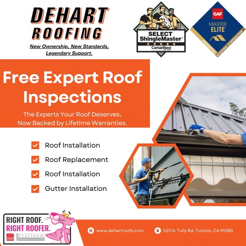 DeHart Roofing inspector examining a roof and taking photos during a free inspection
