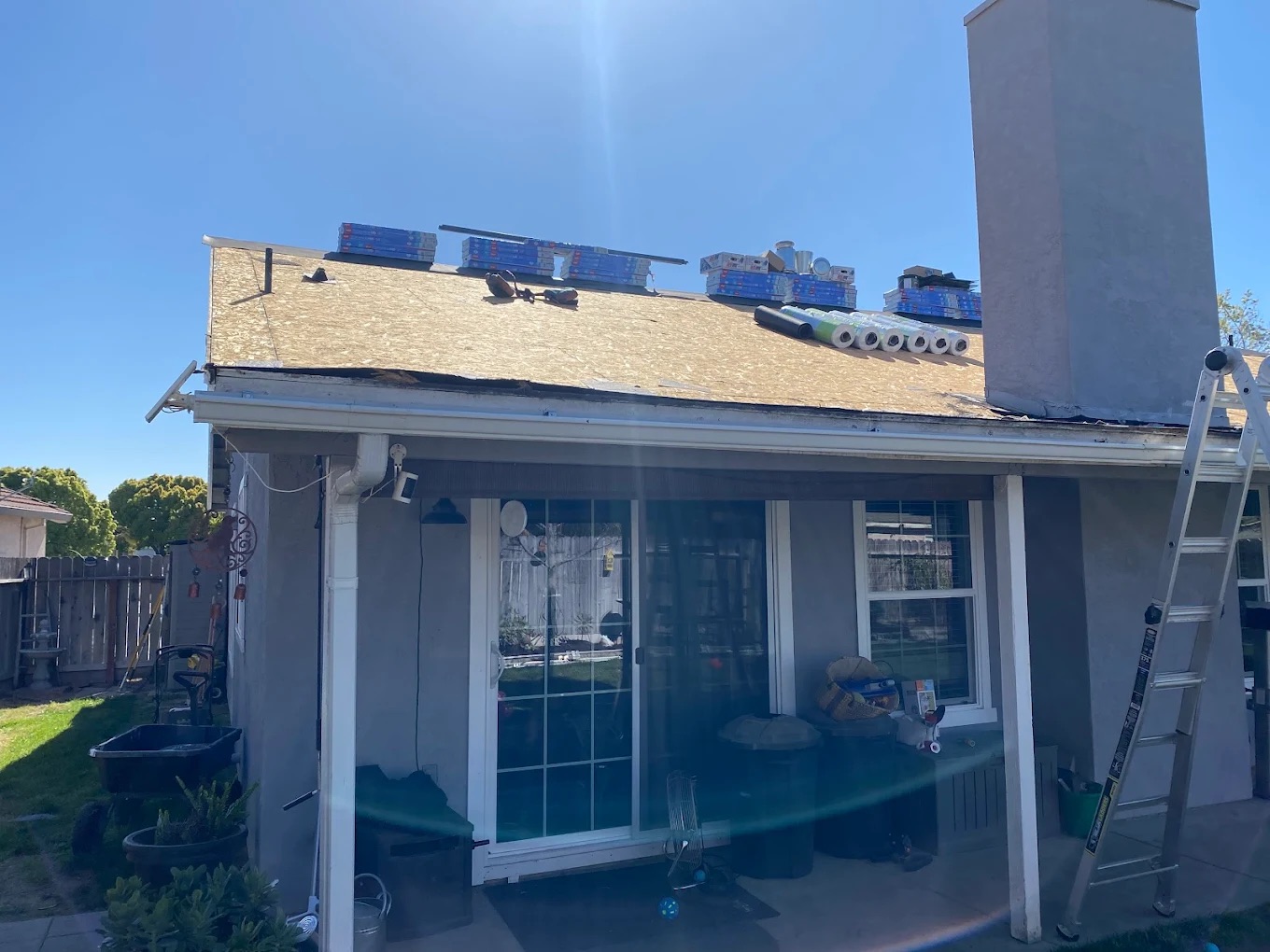DeHart Roofing crew installing a new roof on a Central Valley home