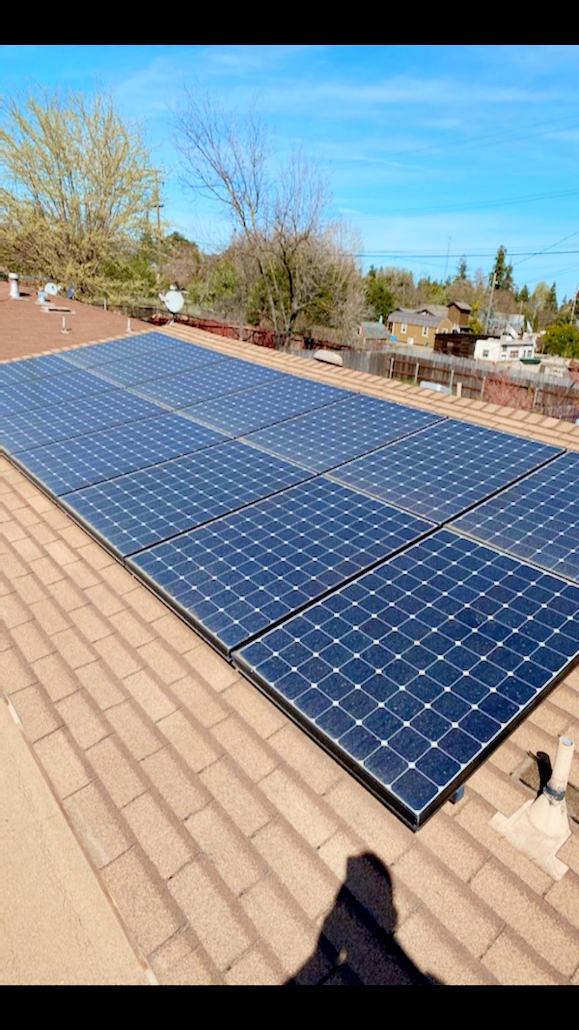 Solar panels installed by DeHart Roofing on a Stanislaus County tile roof